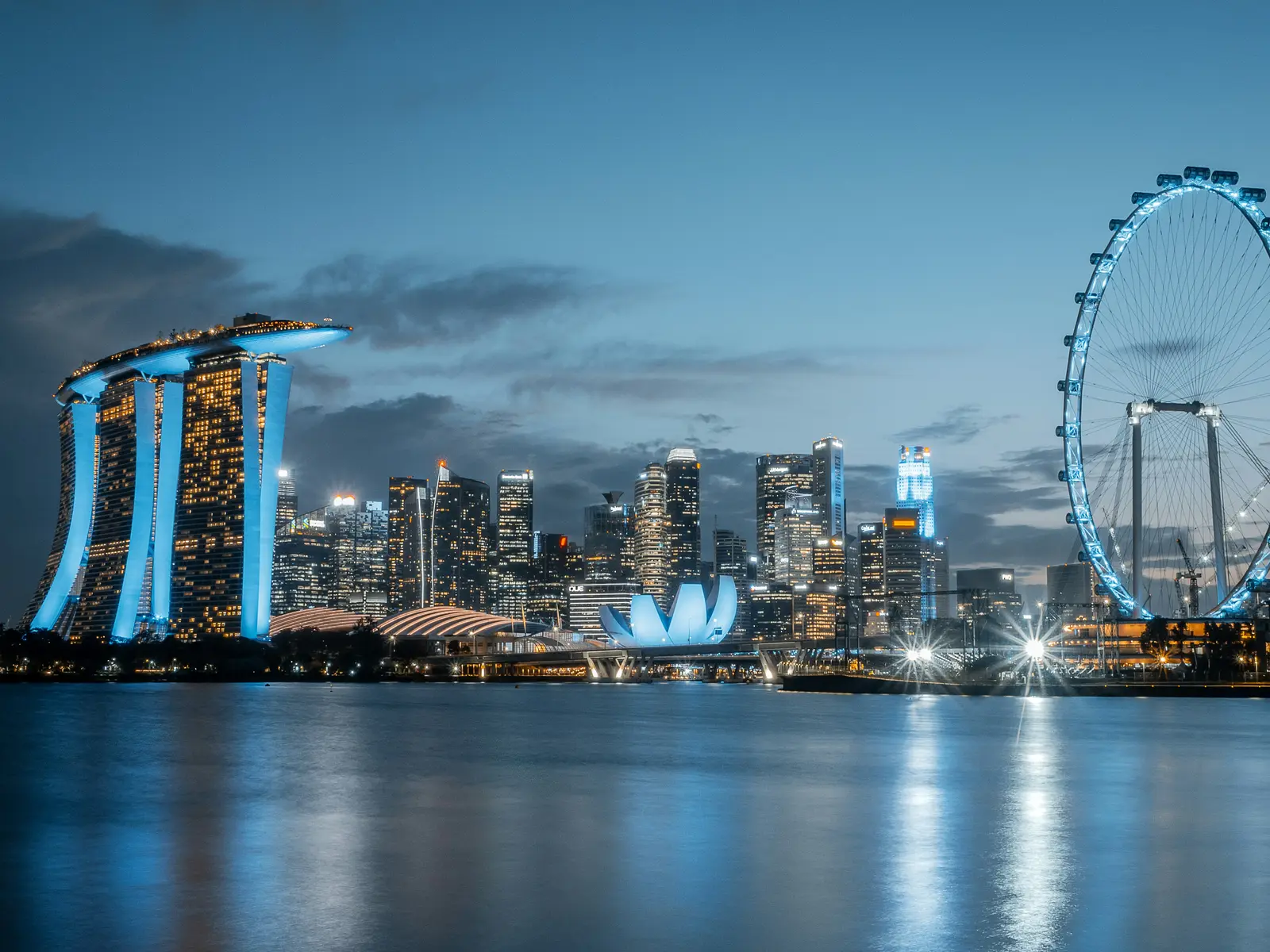 Marina Bay skyline reflected in the water at dusk, Singapore